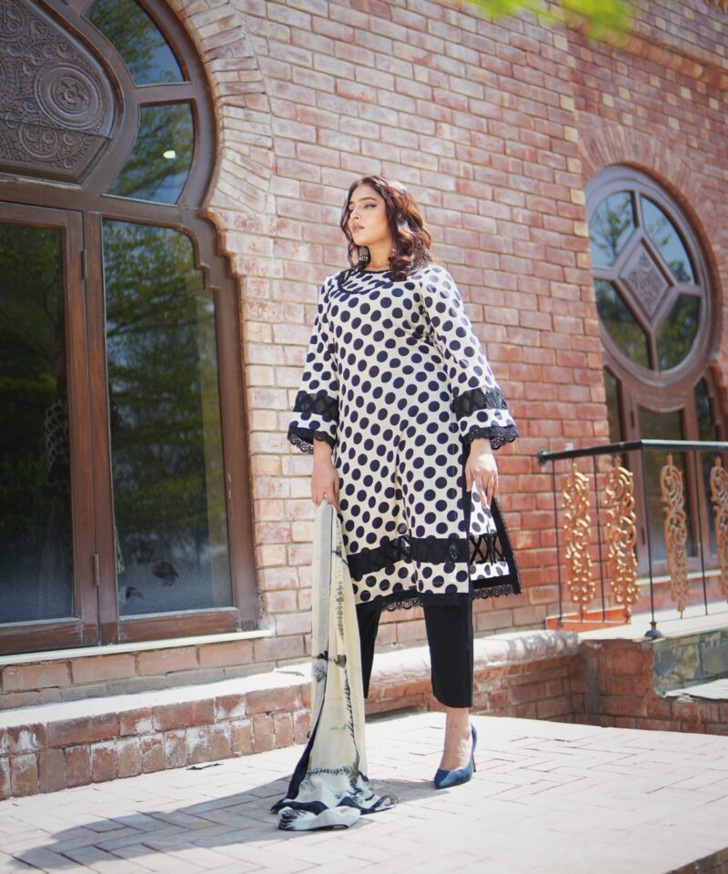 printed lawn shirt beautifully crafted with laces on with plain trousers along with pure tie and dye dupatta