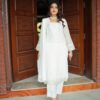 White embroidered semi formal dress for women with chiffon dupatta and silk trousers, elegant Pakistani festive wear