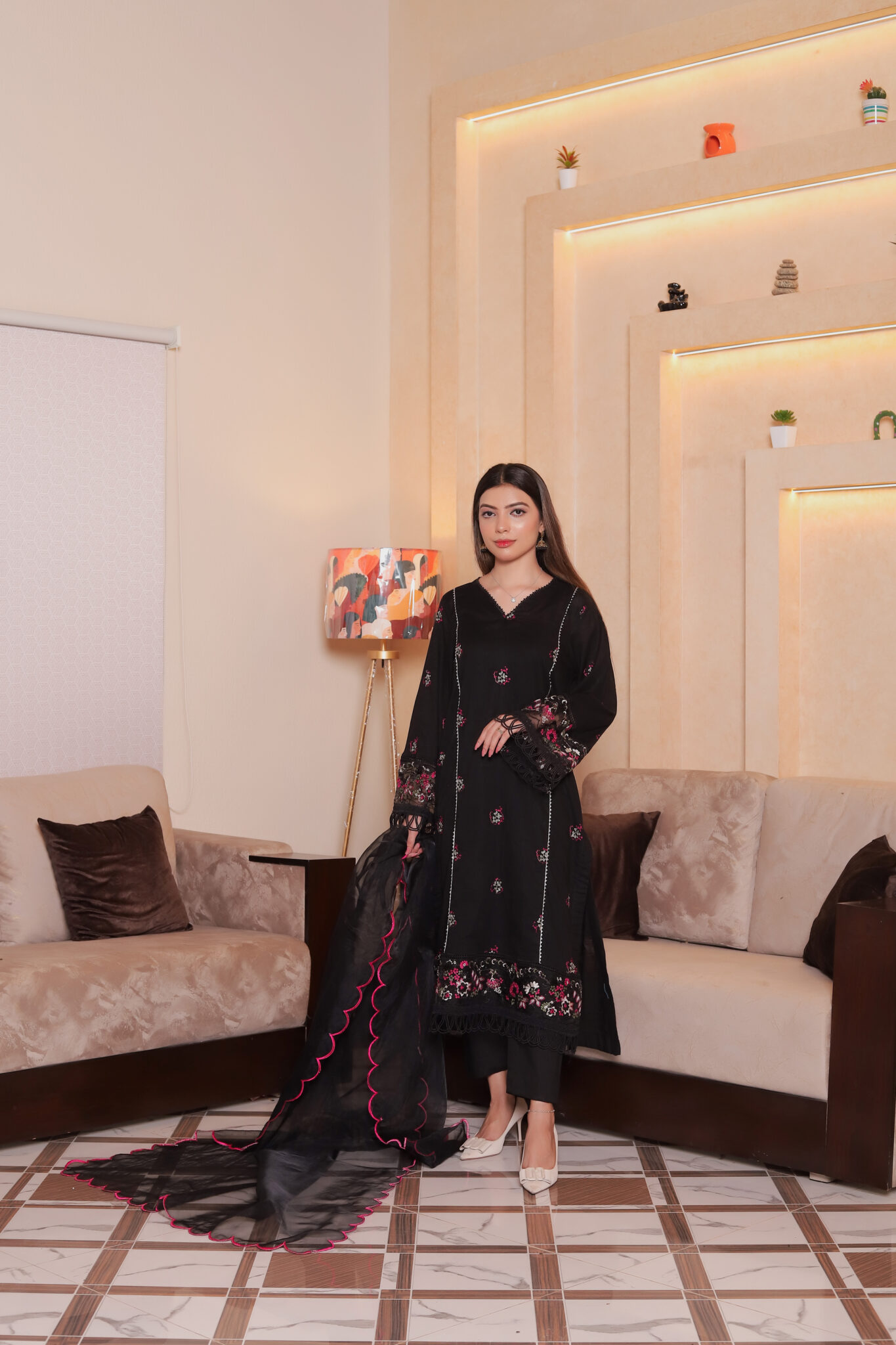 Black fine lawn semi formal dress for women with embroidered neckline, ideal for semi traditional events or wedding guests